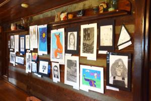 Students could enter the Juried Art Show in seven different categories including: painting, drawing, photography, graphic design, mixed media, ceramics and sculpture. All works were displayed in the Turner Log Cabin for students to see what their peers had submitted. (CU Photo By Kasey Ricketts) 