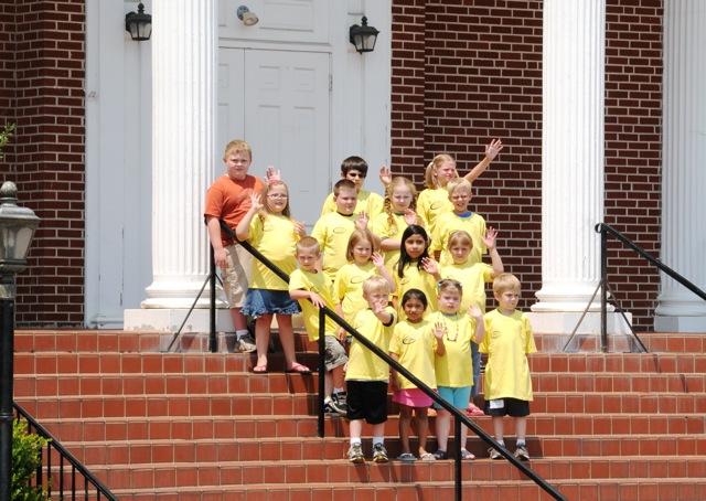 Albany Kids College, grades one through four, are pictured on the steps of the Albany First Baptist Church. Unless noted otherwise, all students are from Clinton County. The students in this group are, first row, from left: Bode Copeland, Jaden Mullins, Nikki Dominguez and Aiden Horner. Row two: Annessa Roysdon, Sidney Dominguez, Clarissa Gregory and Cyrus Vincent from Burkesville. Row three: Marcus Moons, Rhiannon Lovelace, Coulan Beck and Hannah Wade. Row four: Delilah Talbott, William Chaplin and Ethan Horner. (CU Photo by Linda Waggener)