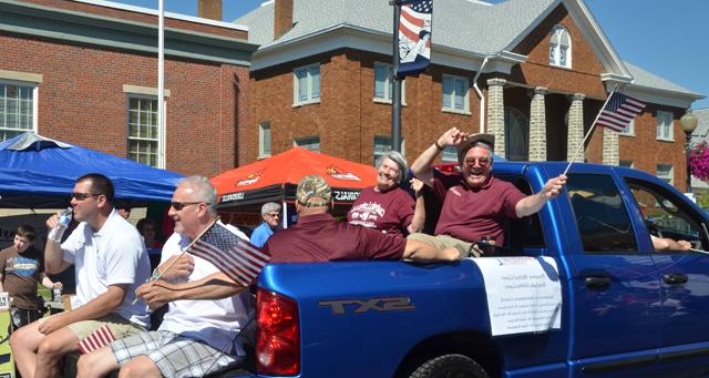 Members of the CU Administrative Council ride in the back of CU president Michael Carter's truck  in the July 4th parade in downtown Campbellsville. From left are back Dr. Keith Spears and Ginny  Flanagan with Rusty Hollingsworth in center and Dave Walters and Benji Kelly in front. Otto Tennant drove the truck with Dr. Frank Cheatham inside. (Campbellsville University Photo by Joan C. McKinney)