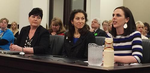 Ashli Watts, left, testifies before a legislative committee on a smoke-free  workplace law.