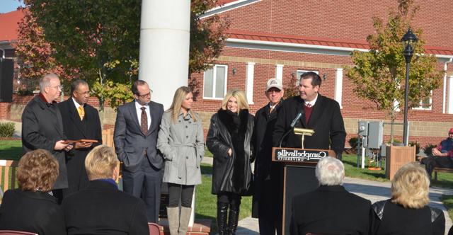 Benji Kelly, vice president for development, speaks at the dedication of the Alumni & Friends  Park, Noe Plaza dedication. From left are Dr. Larry and Beverly Noe, Ashley Noe Meister and her husband Dr. David Meister, Dr. Joseph Owens, chair of the CU Board of Trustees, and Dr. Michael V. Carter, president. (CU Photo by Joan C. McKinney)