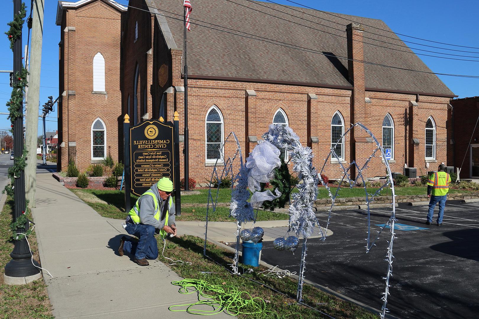 Bill Brewer lights up lights on Main Street