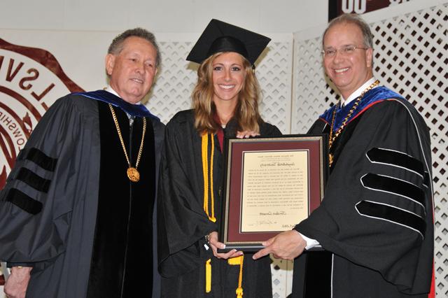 Jordan Cornett, center, receives the Algernon Sydney Sullivan Award at the undergraduate commencement from Dr. Michael V. Carter, president of CU, and Dr. Frank Cheatham, vice president for academic affairs. (Campbellsville University Photo by Christina Kern)