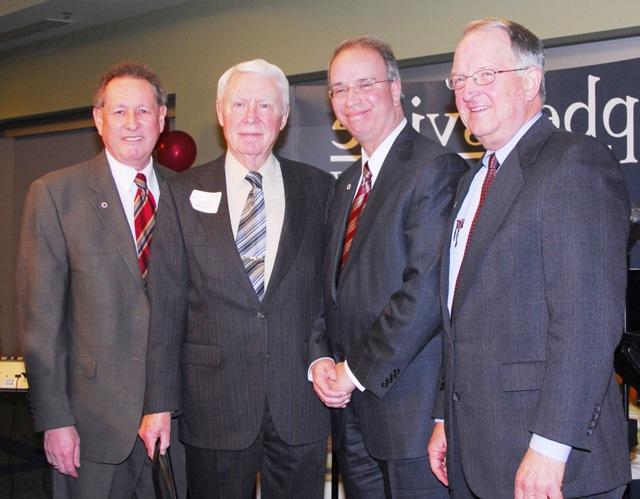 Dr. W. Morgan Patterson, second from right, is honored during Campbellsville University's Centennial Campaign Celebration Dinner. Patterson is pictured with, from left, Dr. Jay Conner, chair of CU's Board of Trustees, Dr. Michael V. Carter, president, and Dr. Frank Cheatham, vice president for academic affairs. (Campbellsville University photo by Joan C. McKinney)