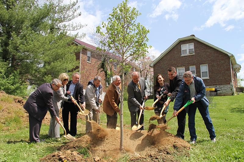 As part of Campbellsville University's Earth Day celebration, a new tree was planted in Turner Log Cabin Park by those who participated in the event. From left, are: Dr. Richie Kessler, environmental studies program coordinator and chair of the Kentucky Heritage Land Conservation Fund, Michael Jennings, GPA president, Constanze Malzer, Green Minds president, Campbellsville Mayor Tony Young, Taylor County Judge/Executive Eddie Rogers, George Howell, a principal donor of Clay Hill Memorial Forest, Dr. Frank Cheatham, senior vice president for academic affairs, Carla Goldsmith, retail operations manager at Kentucky Utilities, and Dr. John Chowning, vice president for church and external relations and executive assistant to the president. (Campbellsville University Photo by Rachel DeCoursey)