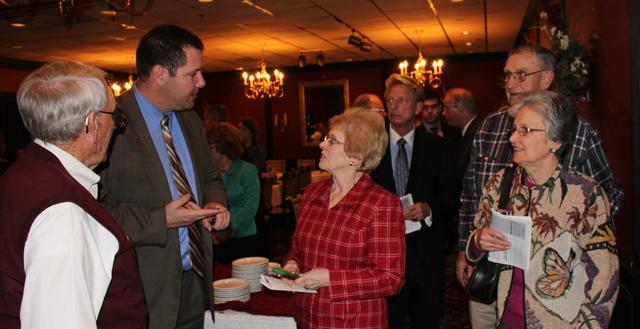 Benji Kelly, second from right, vice president for development, talks with Anna Gosser of Elizabeth- town, with her husband, Dr. Donnie Gosser, a member of CU's Board of Trustees, at right. At far left is Jana Gore of Elizabethtown, also a member of the CU Board of Trustees, and her husband, Dr.  Lewis Gore. (Campbellsville University Photo by Drew Tucker)