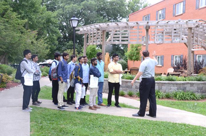 From left Andrew Vaughn and Joey Hartlage, admissions counselors at Campbellsville University, giving campus tour to students from India. (Campbellsville University Photo by Joshua Williams)