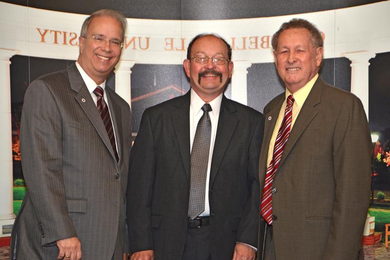 Joe Foster, center, received an award for 30 years of service to Campbellsville University from Dr. Frank Cheatham, senior vice president for academic affairs, and Dr. Michael V. Carter, president. Foster, also, was named the Distinguished Professor by the Advancement Board at Honors and Awards Day. (Campbellsville University Photo by Joan C. McKinney)