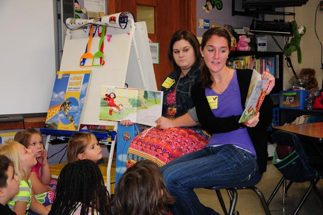 Campbellsville University’s School of Education students Kaela Vessels, left, of Vine Grove, Ky., and Robin Smith of Campbellsville read to students during the Jumpstart reading program. (Campbellsville University Photo by Ellie McKinley)