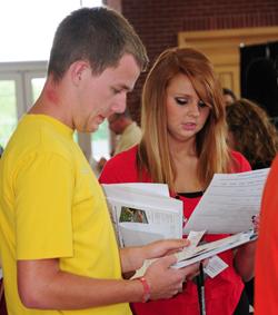 Keela Forrest, left, and Dakota Boyett,  both of Taylor County, study LINC  materials at the June event.  (Campbellsville University Photo by Ellie  McKinley)