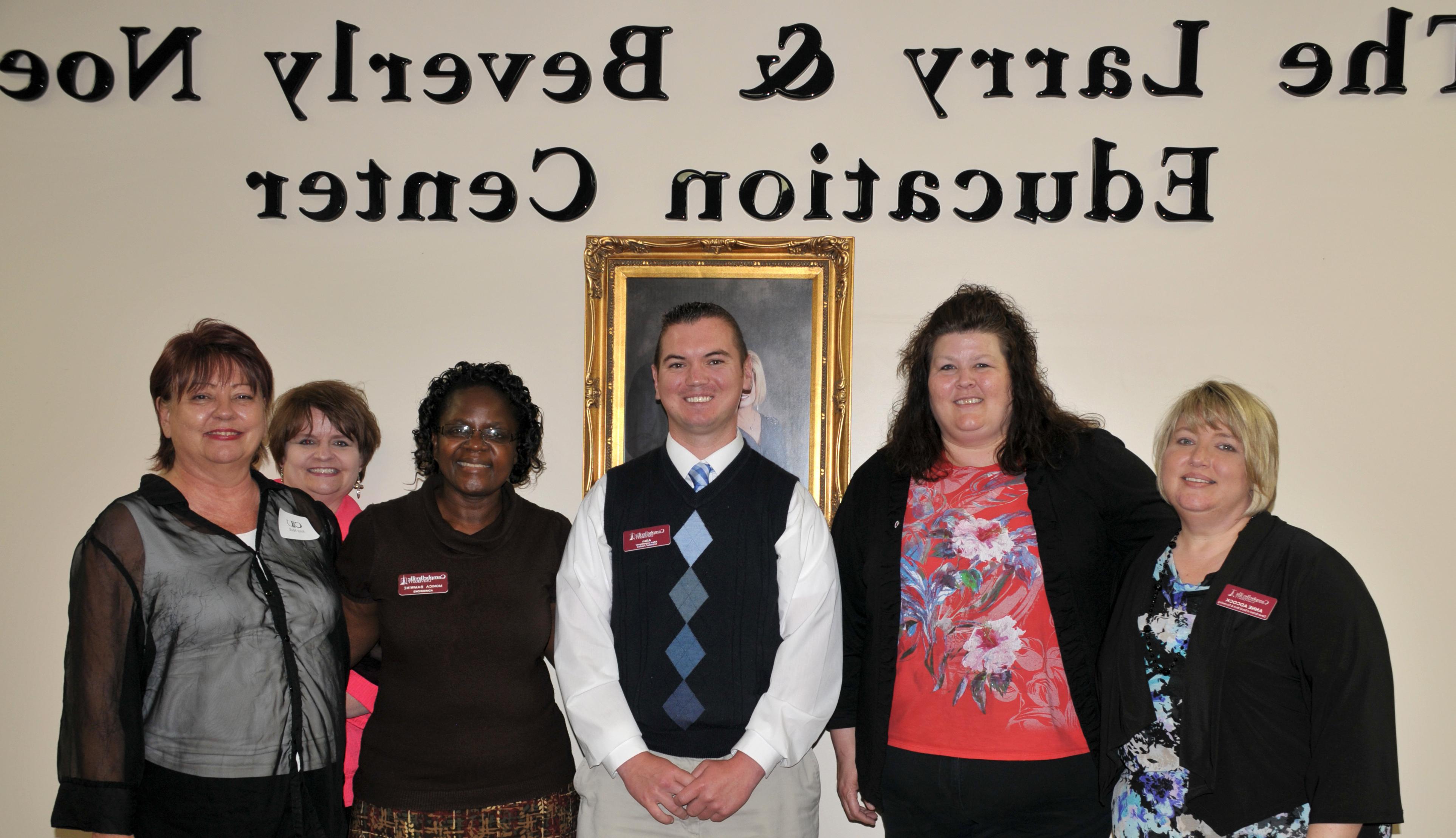 Monica Bamwine, third from right, CU director of graduate and professional enrollment, brought her Somerset team together May 8 at the alumni and friends dinner. She credited those present who have worked to keep consistency of services and growth of the Somerset Center since the year 2,000. From left are: Anne Adcock, current director of CU's Somerset Noe Center; Cindy Dishman, former CU Somerset admissions counselor; Allen Copenhaver, instructor in criminal justice; Bamwine; Gina Sears, admissions counselor and degree completion support in Somerset; and Gerri Hull, former admissions counselor. (Campbellsville University Photo by Linda Waggener)