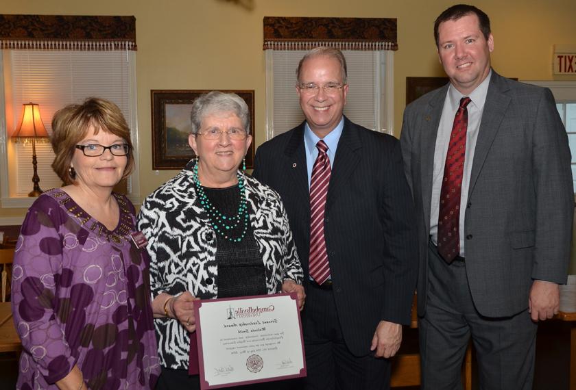 Malinda Smith, second from left, receives the Servant Leadership Award at the “Campaign for the Commonwealth” event in Stanford, Ky. From left are: Benji Kelly, vice president for development; Smith; Paula Smith, director of alumni relations; and Dr. Michael V. Carter, president. (Campbellsville University Photo by Joan C. McKinney)