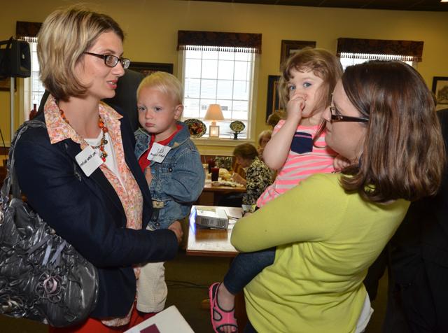 Jessica Whitaker Page ('05) and Alleena Koss Van Horn ('04) talk with their children, Carlee Page, and Emmit Van Horn at the event. (Campbellsville University Photo by Joan C. McKinney)  