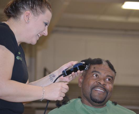 Perry Thomas, head football coach at Campbellsville University, had his head shaved at St. Baldrick's March 21. (Campbellsville University Photo by  Mikayla Smith)