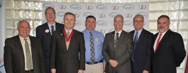 Speakers at Campbellsville University's Kentucky Proud Farm to Campus announcement were with Pioneer College Caterers Inc. representatives. From left are Bam Carney; Tony Young; Dr. Michael V. Carter; Heith Hall, CU food services director for Pioneer; James Comer; Tim Wolters, vice president for operations for Pioneer College Caterers Inc.; and Dan Poset, district manager for Pioneer College Caterers Inc. (Campbellsville University Photo by Linda Waggener)