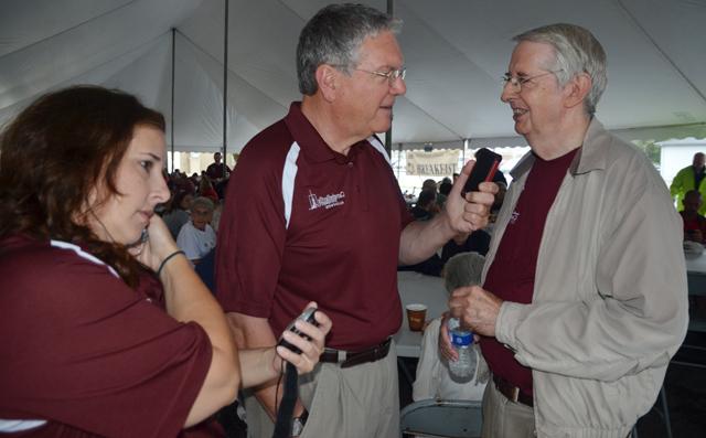  Dr. Keith Spears of WLCU-FM 87.5, right, interviews Randy Herron, chair of the elders at Campbellsville Christian Church, during the church's annual free breakfast during the July 4 event. At right, Jeannie Clark, also of WLCU-FM, was producing the show and giving time cues. WLCU-FM will be covering the parade and car show live July 13 as the July 4 events were postponed due to rain and rescheduled for July 13. Fireworks will be held July 12. (Campbellsville University Photo by Joan C. McKinney)