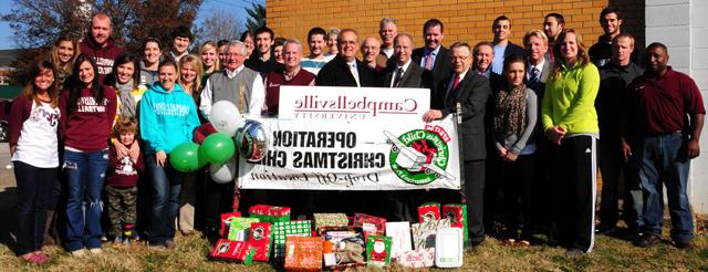  Leaders from the Campbellsville-Taylor County community and Campbellsville University gathered at the Taylor County Relay Center to celebrate Operation Christmas Child efforts. Taylor County raised 5,238 shoeboxes to be delivered around the world. Campbellsville University raised 1,116 of the total number of shoeboxes. (Campbellsville University Photo by Ellie McKinley)