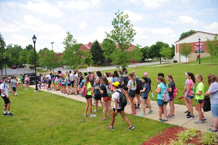 FCA campers stand in line for packed lunch before they go into the community. (Campbellsville University Photo by Josh Christian)