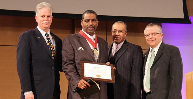 The Rev. Keith Marshall Williams, third from left, receives Campbellsville University's  Leadership Award at chapel. From left are: Dr. John Chowning, vice president for church and  external relations and executive assistant to the president; Dr. Joseph L. Owens, chair of the CU  Board of Trustees;  Williams and the Rev. Ed Pavy, director of campus ministries at CU.  (Campbellsville University Photo by Rachel DeCoursey)