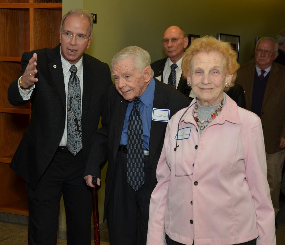 Janet and Dr. Randy Davenport, President's Club founder and former CU president, meets Dr.  Michael Carter, current CU president, at the entrance of the President's Club dinner  (Campbellsville University Photo by Drew Tucker)