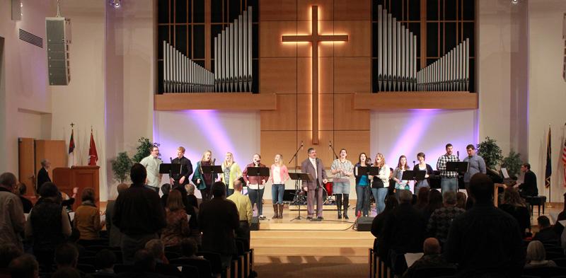  Dr. Tony Cunha, center, dean of the School of Music, sings with Campbellsville University students at last year's event. (Campbellsville University Photo by Rachel DeCoursey)