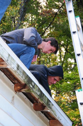  Campbellsville University students work on roofing  with Kentucky Heartland Outreach. (Campbellsville University Photo by Kasey Ricketts)