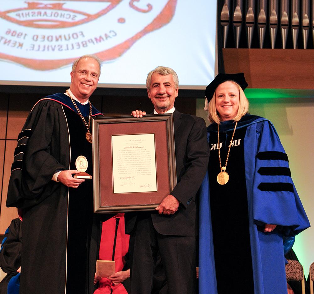 From left, Dr. Donna Hedgepath, vice president for academic affairs, and Dr. Michael V. Carter, president, third from left, present Guy Montgomery with the Algernon Sydney Sullivan Award during the Honors and Awards Day at Campbellsville University. Montgomery is a former associate member of the Campbellsville University Board of Trustees. (Campbellsville University Photo by Joshua Williams)