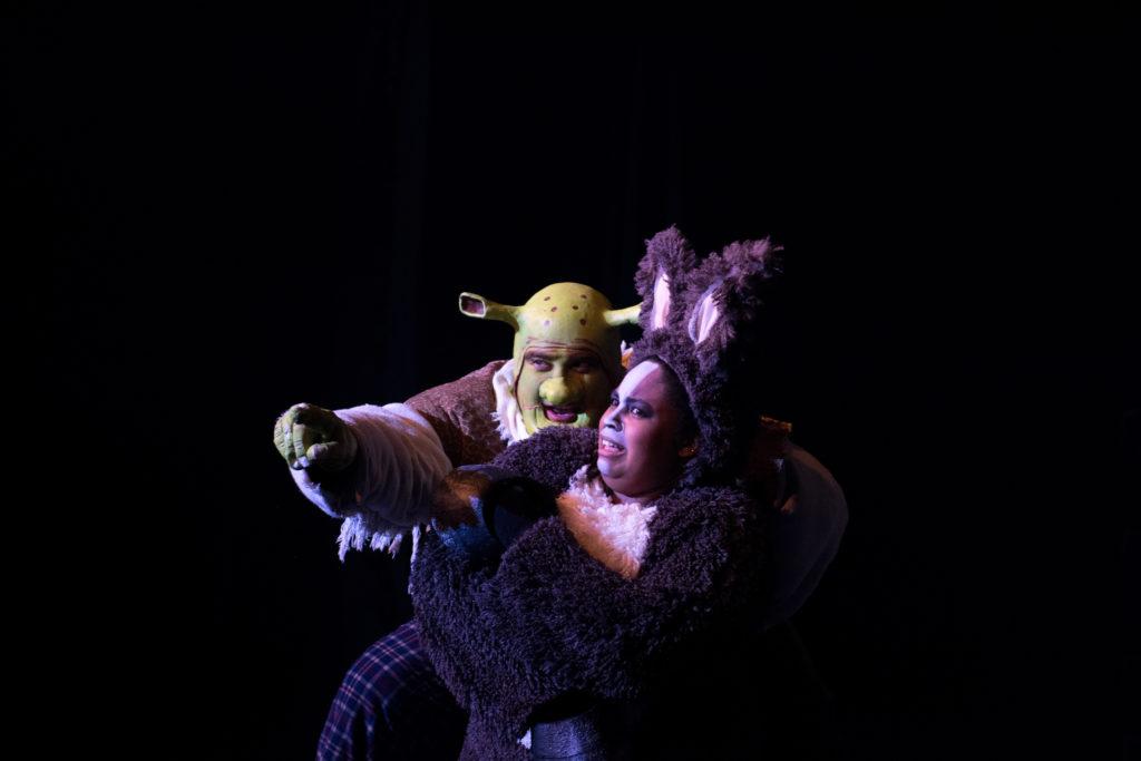 From left Donkey, played by Alica McClendon of Radcliff, Ky., and Shrek, played by Marcus Stanfield of Campbellsville, Ky., perform during Shrek The Musical at Campbellsville University. (Campbellsville University Photo by Joshua Williams)