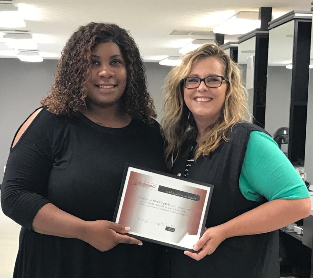 At left, Suzanne Zahrndt, Instructor of Cosmetology at The Brockman Center, presented Aeryl Cobb with her certificate of completion of the cosmetology program. Cobb is the first student to graduate since the cosmetology program at The Brockman Center opened in March 2016.