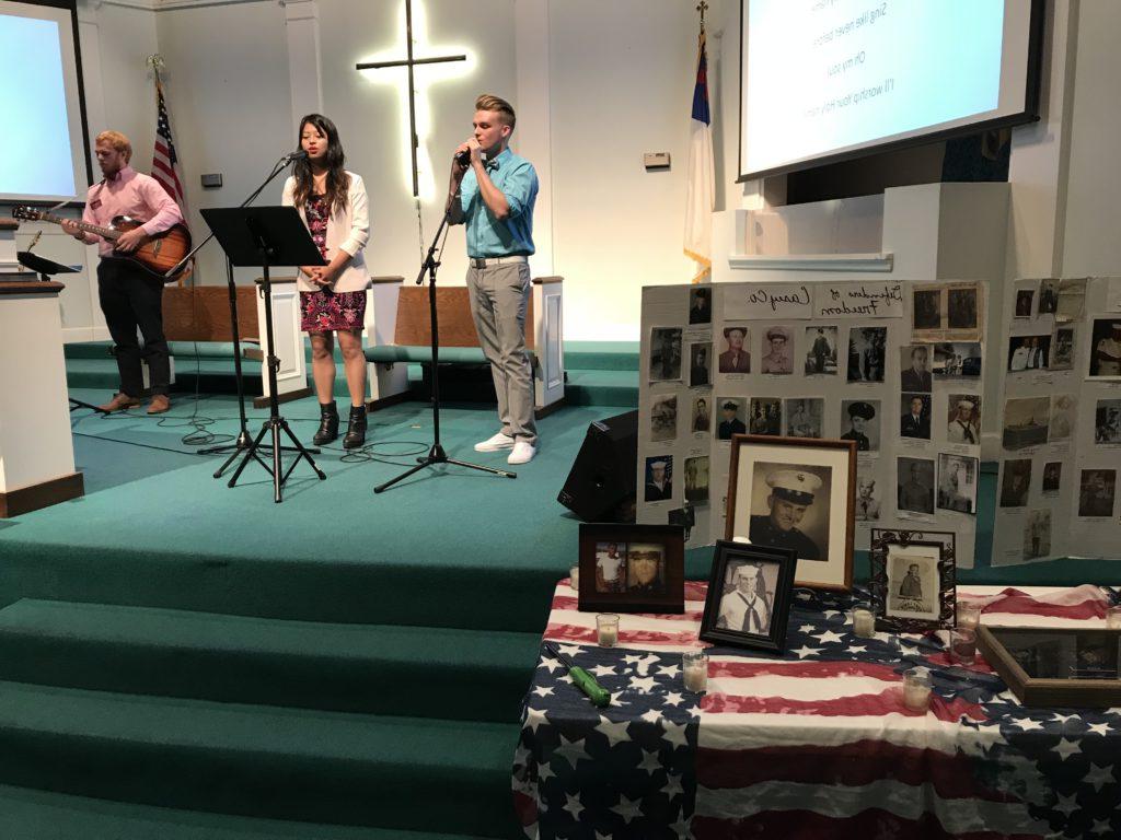 Liberty United Methodist Church welcomed Campbellsville University Church Outreach Sunday. From left, Connor Mattingly, freshman vocalist from Lebanon, Ky.; Chimrila Quinker, freshman vocalist from India; and Devan Bishop, church outreach music coordinator, played music at Liberty United Methodist Church as the church celebrated Veterans Day with a display of pictures and candles lit for the veterans. Veterans present were also recognized and thanked for their service. (Campbellsville University Photo by Joan C. McKinney)